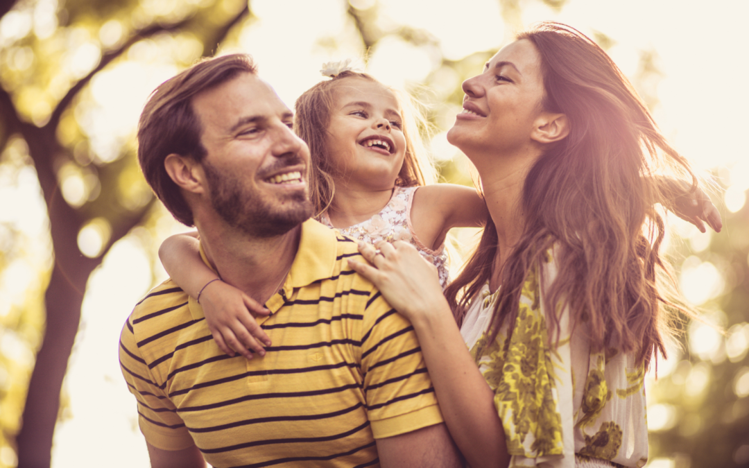 A family standing together, with a guiding compass in the foreground, symbolizing the direction and support provided by parent coaching.