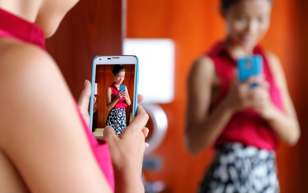 A person gazing into a mirror, revealing a confident and positive reflection, symbolizing the transformative power of therapy on self-esteem